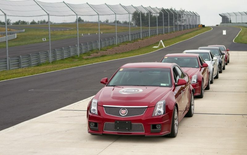 2011_CTS-V-Coupe_18.jpg - [de]CTS-V Coupes aufgereiht entlang der Rennstrecke des Monticello Motor Club, vor einer Pressefahrt in Monticello, New York am 10. August 2010[en]Cadillac CTSv sedans are lined up along the race track prior to a media drive at the Monticello Motor Club in Monticello, New York, Tuesday, August 10, 2010. (Photo by Emile Wamsteker for Cadillac)